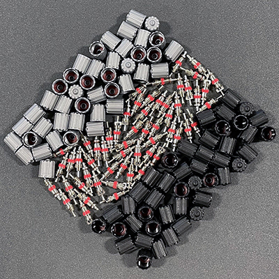 A pile of tire valve components