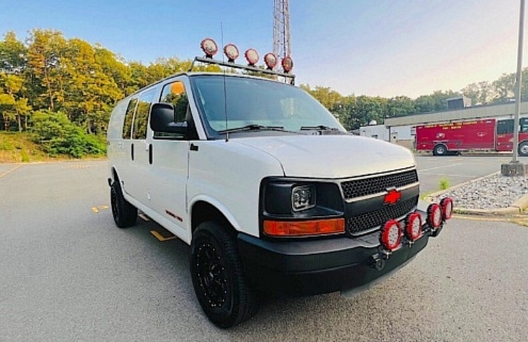 2011 Chevrolet Express 3500 Quigley 4x4 Van - right front profile - featured