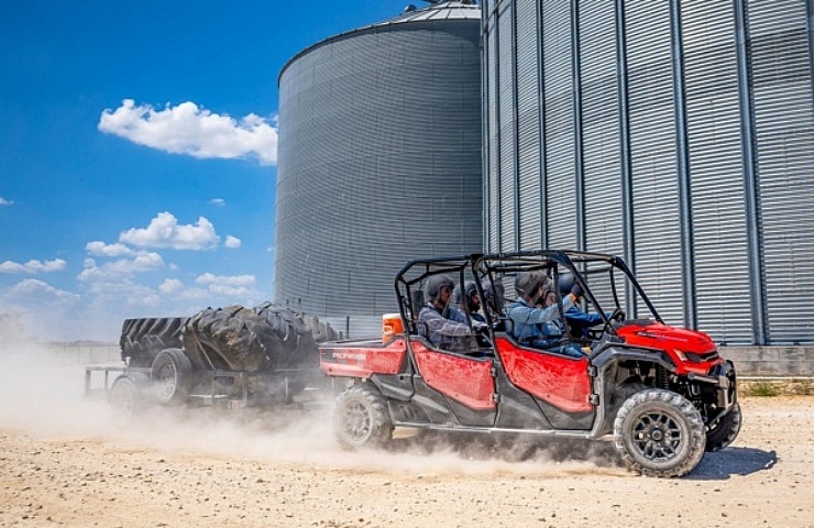 Honda Pioneer 1000 UTV with six passengers and a trailer