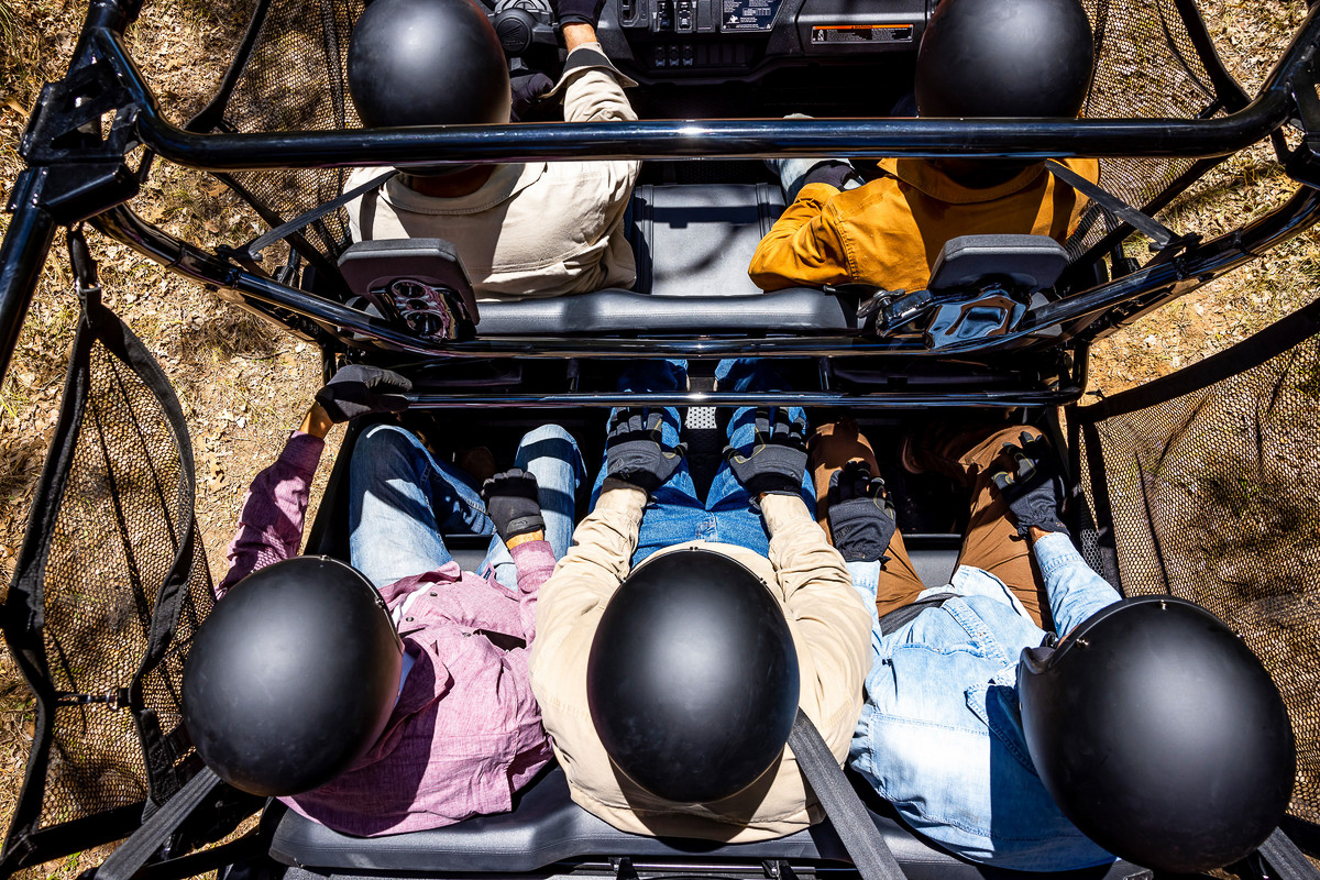 An overhead view of passengers seated in a Honda Pioneer UTV