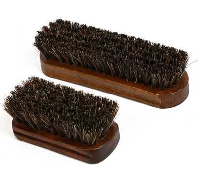 A pair of car leather car seat cleaning brushes