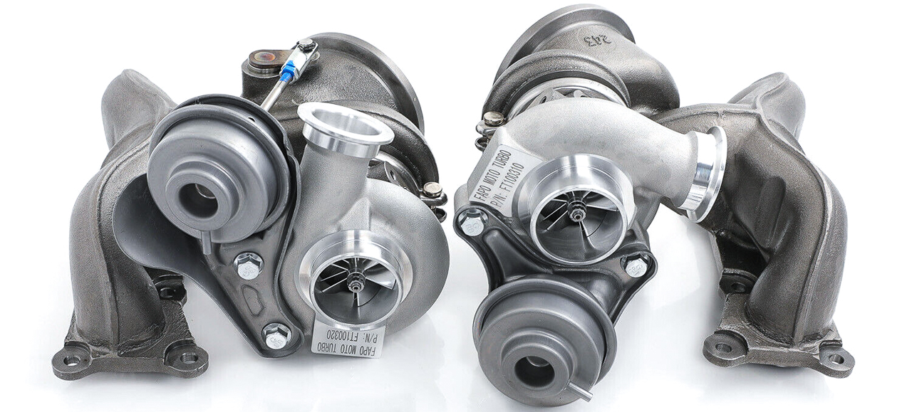 A pair of aftermarket turbochargers for a BMW N53 V-8 engine
