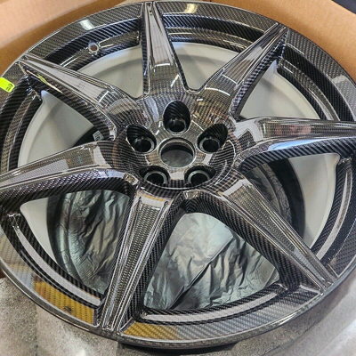 A close-up photo of a Ford Mustang GT500 factory carbon fiber wheel