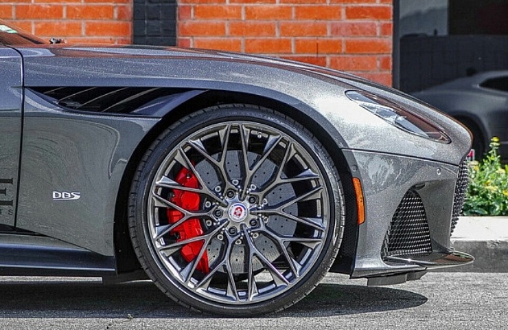 A side view of the front of an Aston Martin Superleggera with HRE forged wheels