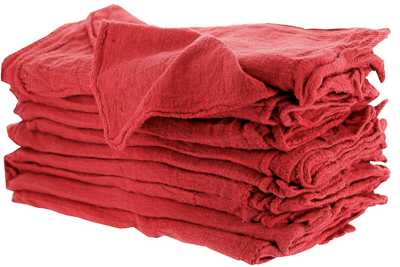 A clean stack of red automotive shop rags.
