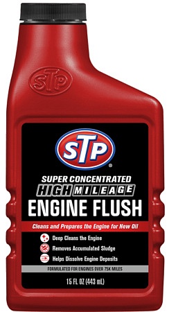 A red 15 oz plastic bottle of STP high mileage engine flush.