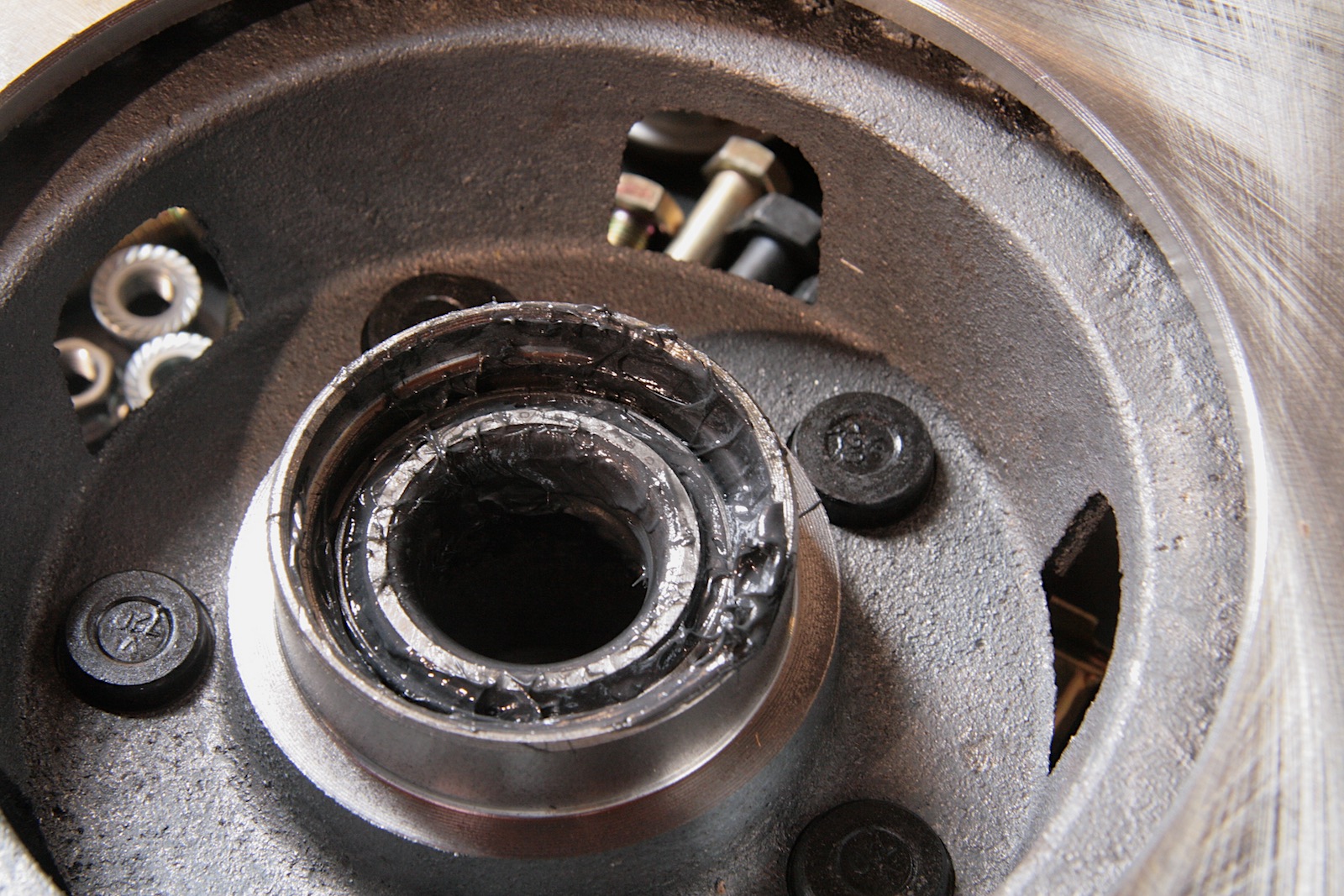 The inner wheel bearing is larger as it supports the bulk of the weight. A press-in seal keeps water out.