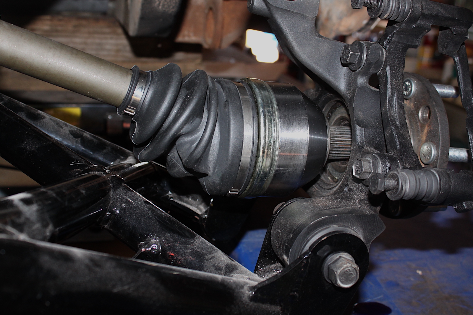 In the vehicle, you can see why these are more difficult. The axle shaft engages the hub directly, so the wheel bearings are much larger than the non-drive style.