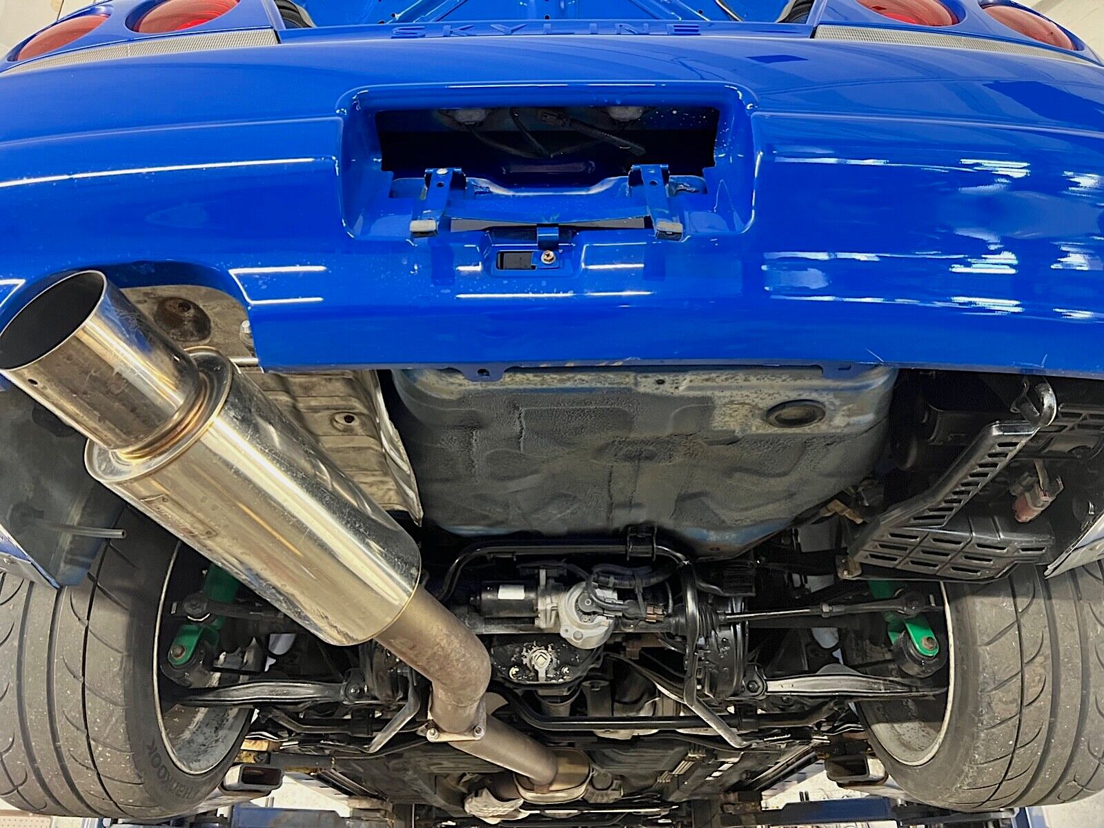 Rear suspension and exhaust