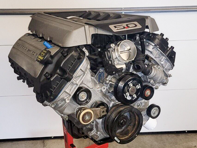 A first generation Ford Coyote V-8 on an engine stand.