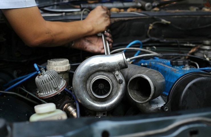 Mechanic working on turbocharger