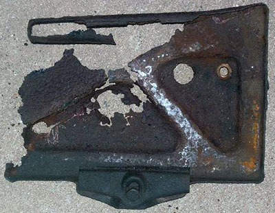 A metal battery tray that fell apart