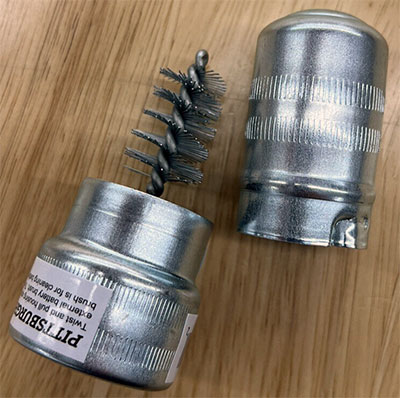 A battery terminal brush