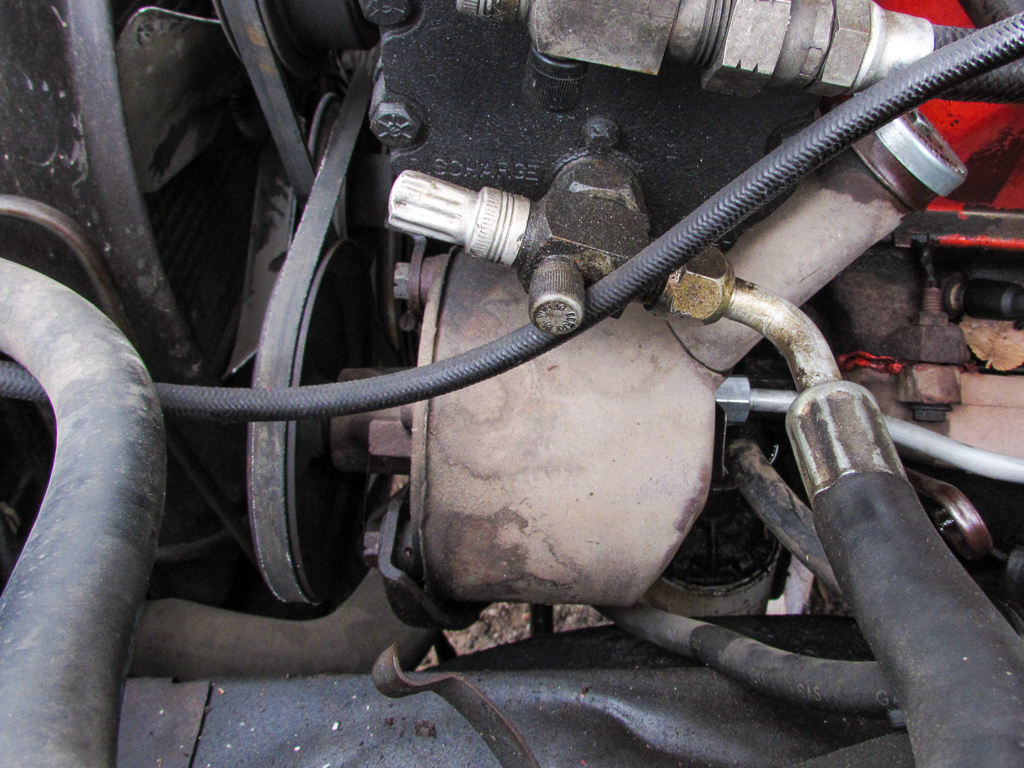 A power steering pump in an older Ford vehicle