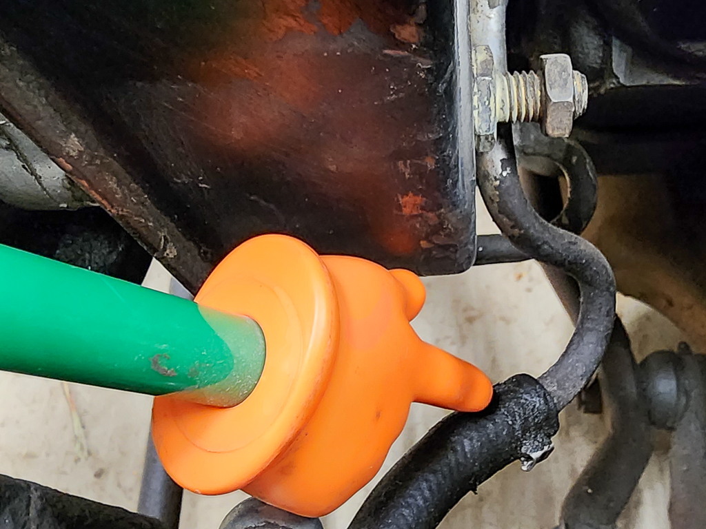 A spring clamp on a low-pressure power steering return hose
