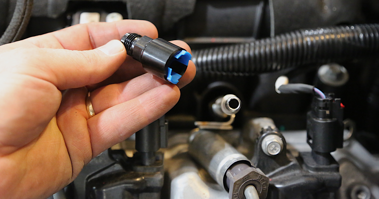 Squeeze the plastic clip or use a release tool?