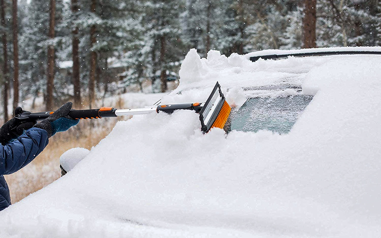 Remove extra snow with a brush scraper before defrosting windows.