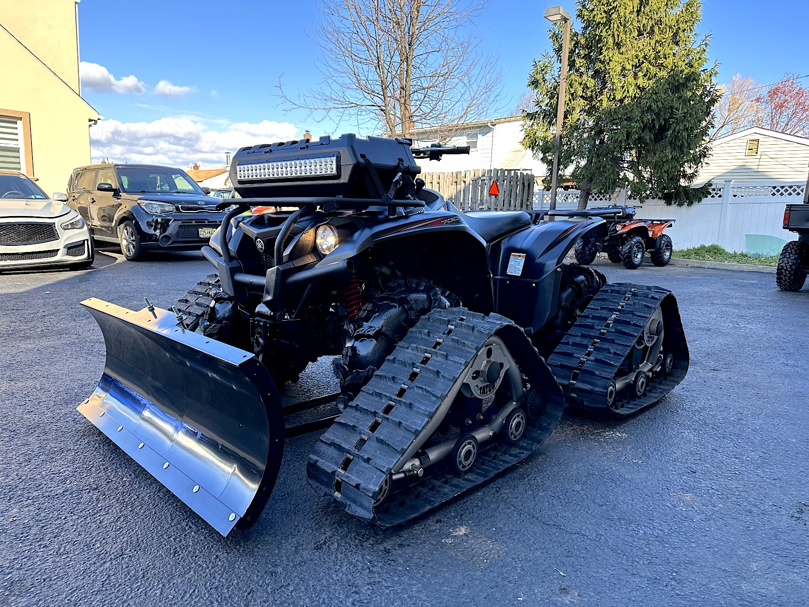 2019 Yamaha Kodiak 700 EPS - left front profile -with tracks and plow