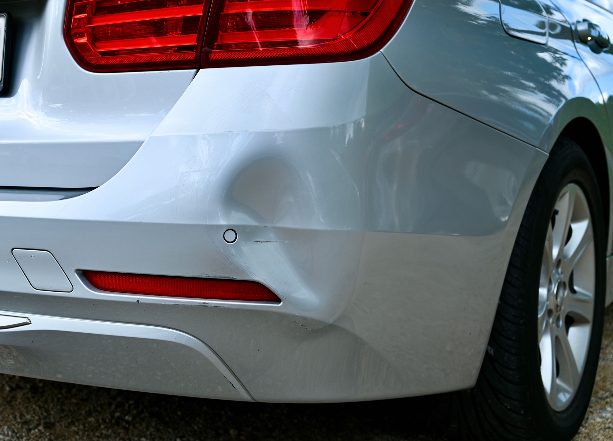 Dented rear bumper damaged after an accident