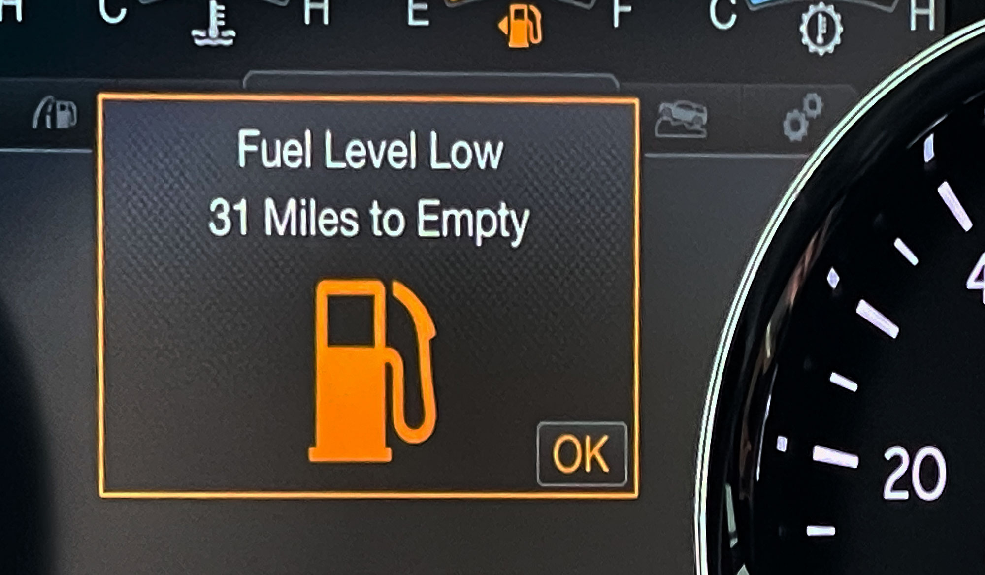 A dashboard message showing how many miles to empty