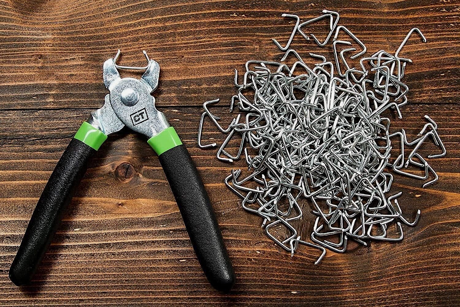 Hog ring pliers and a pile of rings