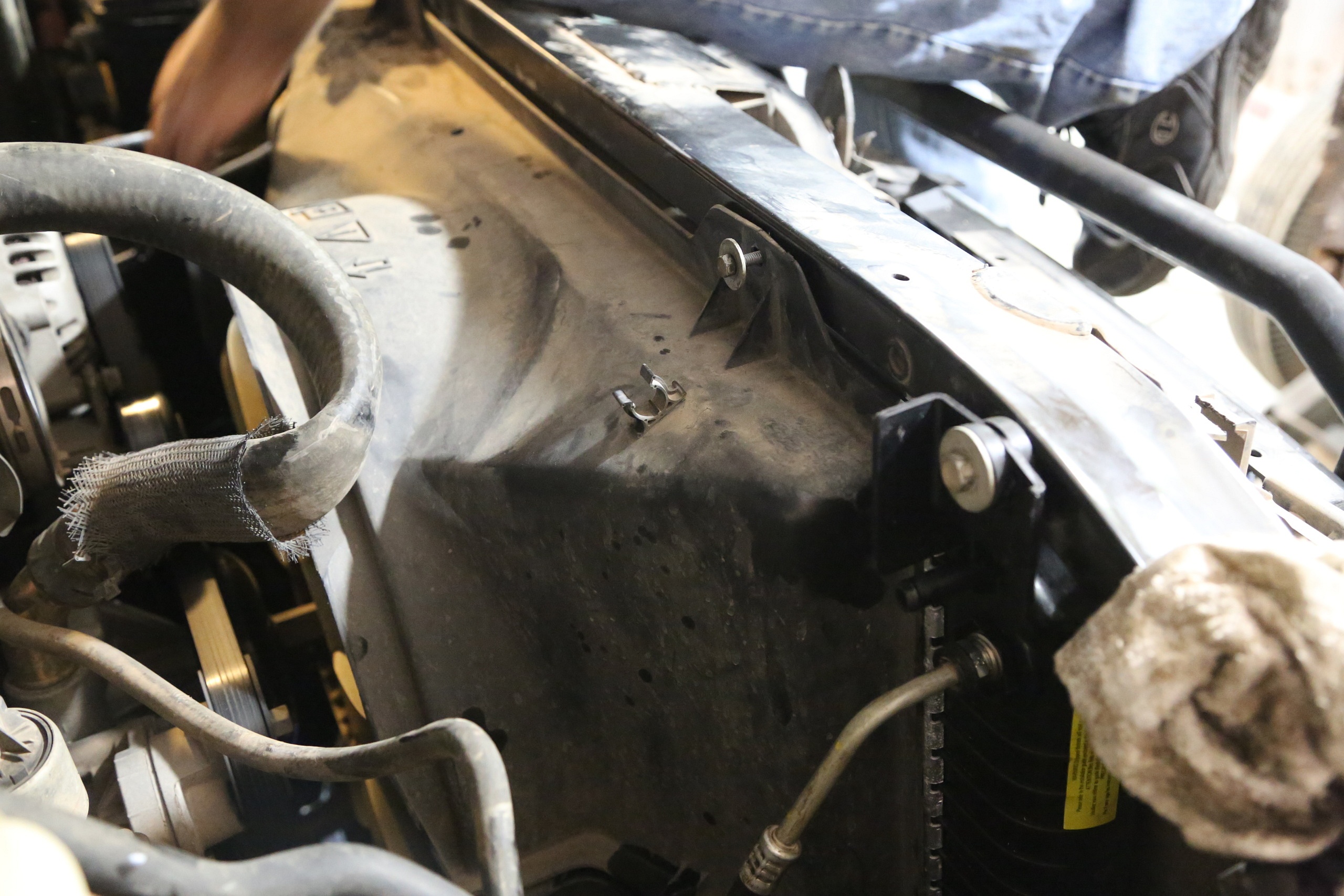 Fan shrouds must be removed in order for the radiator to be pulled