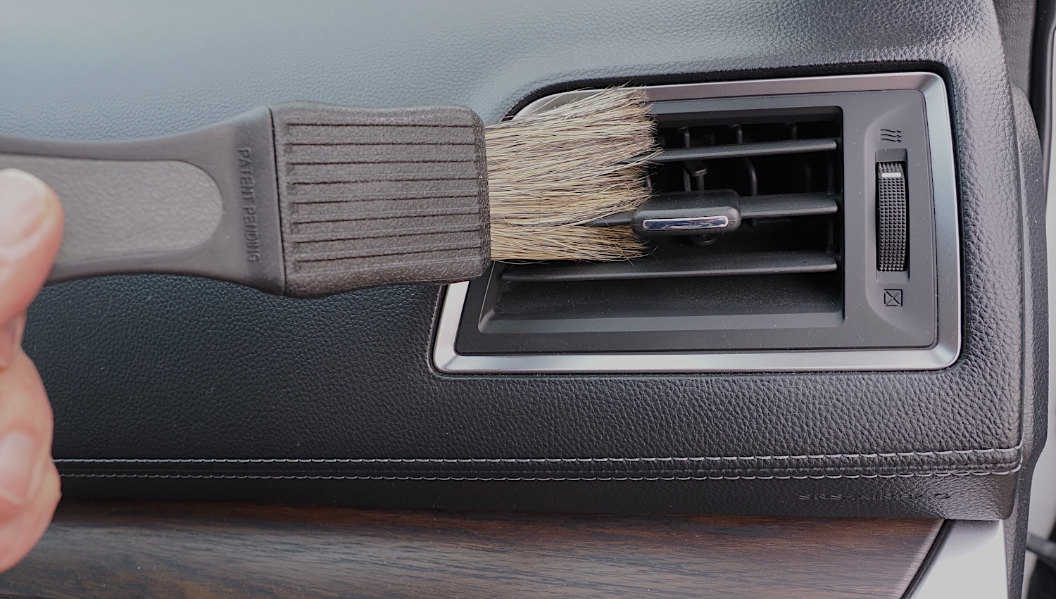 A soft bristle detailing brush is comes in handy when cleaning car interiors. 