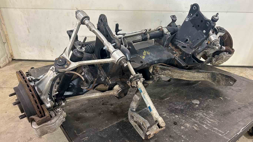 A used Corvette front suspension removed from the car