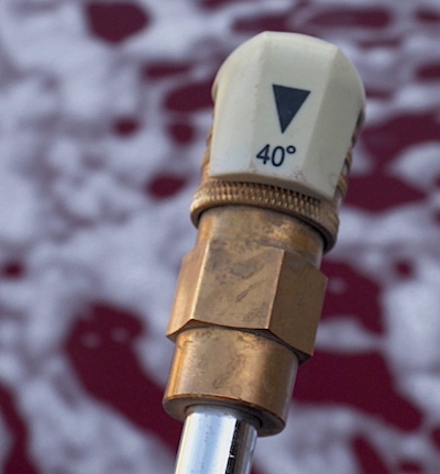 washing your car with a wide pressure washer nozzle