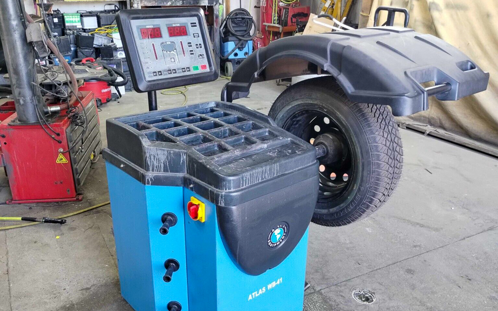 An automotive wheel balancing machine