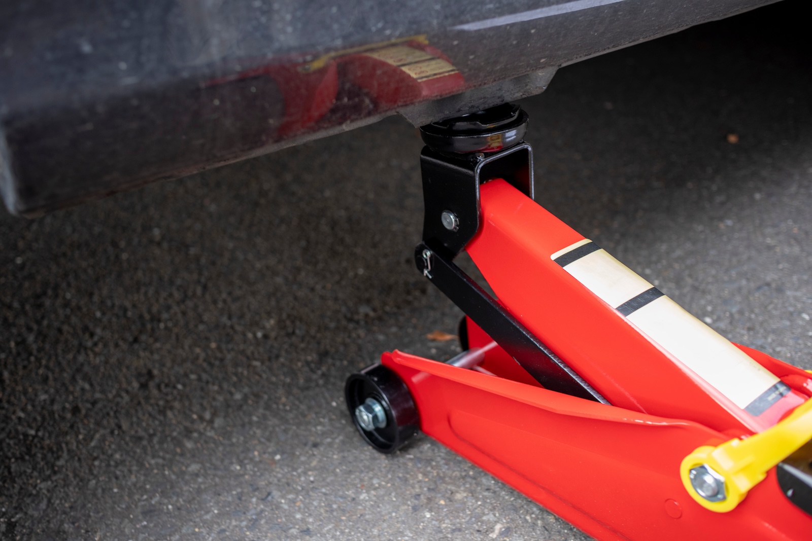 Floor jack placed at jack point