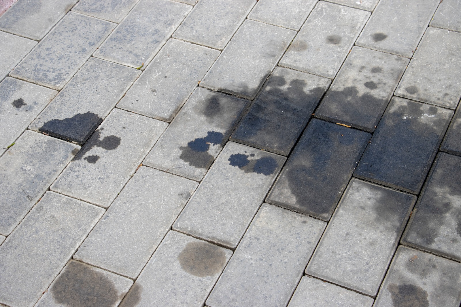 Removing oil stains from driveway pavers