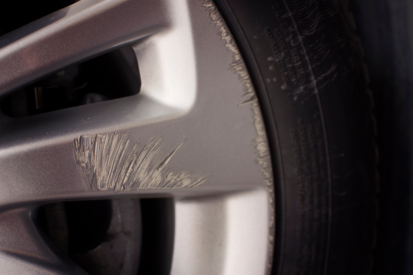 An alloy wheel with curb rash