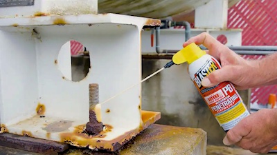 Spraying PB Blaster on rusted bolt