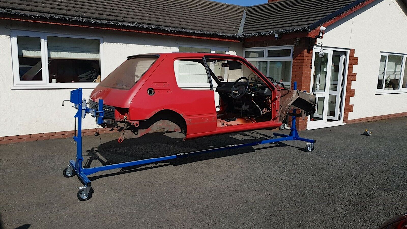 When mounted on the rotisserie, the vehicle undergoing restoration can be wheeled around easily to allow access or for storage.