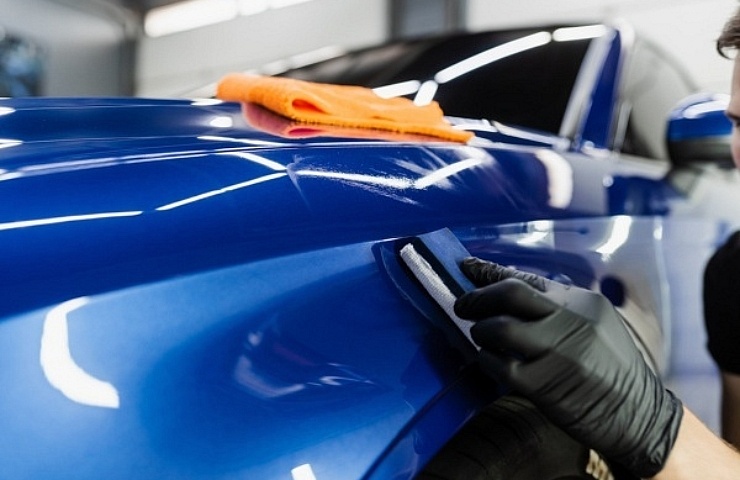 Technician applies ceramic coating