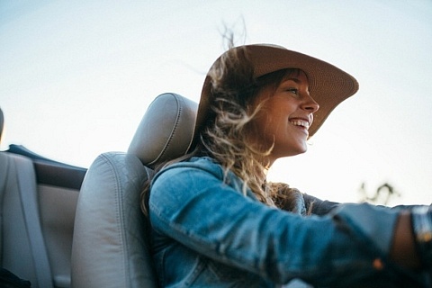 Woman driving convertible