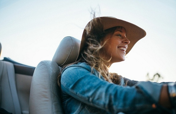 Woman driving convertible